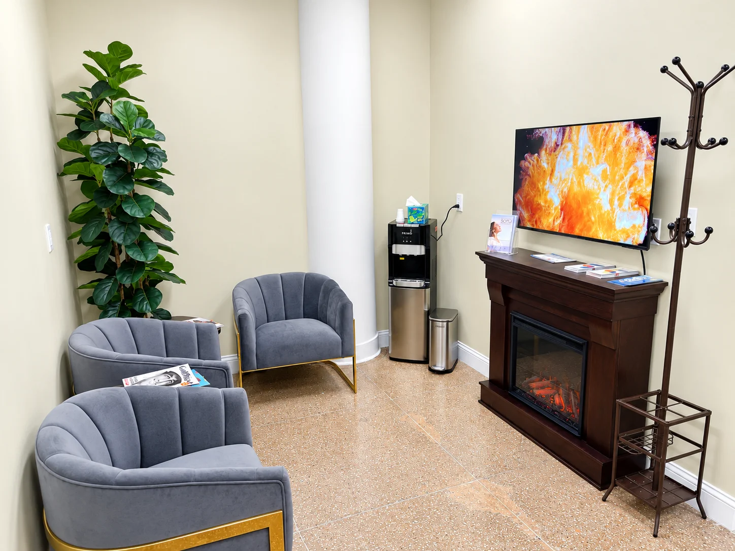 Reception lounge with armchairs and a fireplace